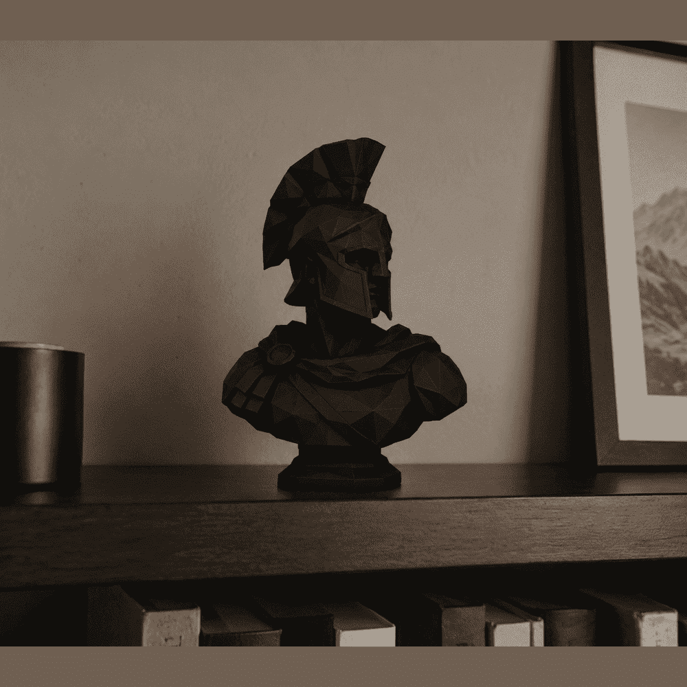 Low-Poly Spartan Bust — Matte Black Resin Collectible Sculpture. The courage of ancient Sparta, reduced to pure geometry. A Spartan warrior bust reinterpreted in low-poly style: clean, sharp facets and matte black finish. Taraflo Taraflo Low-Poly Spartan Bust