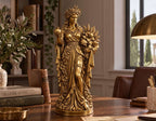 Statua Persefone dorata effetto oro con corona di spighe e luna, melograno e fascio di spighe, su scrivania in legno